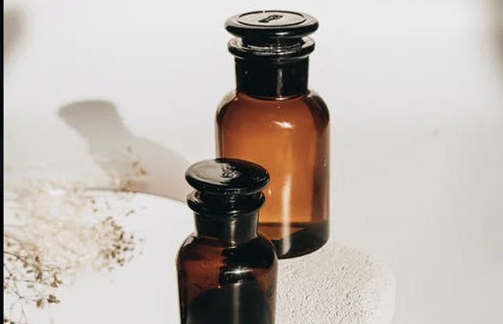 Brown Glass Bottles on White Surface